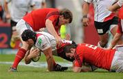 8 April 2012; Stephen Ferris, Ulster, is tackled by Mike Sherry, left, and Peter O'Mahony, Munster. Heineken Cup Quarter-Final, Munster v Ulster, Thomond Park, Limerick. Picture credit: Diarmuid Greene / SPORTSFILE