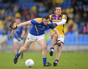 8 April 2012; Donal McElligott, Longford, in action against Brian Malone, Wexford. Allianz Football League Division 3, Round 7, Longford v Wexford, Glennon Brothers Pearse Park, Co. Longford. Picture credit: Ray McManus / SPORTSFILE