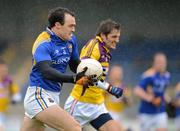 8 April 2012; Paul Barden, Longford, in action against Brian Malone, Wexford. Allianz Football League Division 3, Round 7, Longford v Wexford, Glennon Brothers Pearse Park, Co. Longford. Picture credit: Ray McManus / SPORTSFILE