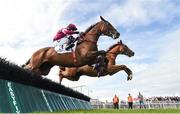 1 August 2017; Eventual winner Housesofparliament, obscured, with Barry Geraghty up, jump the fifth alongside Cinema De Quartier, with Bryan Cooper up, on their way to winning the Colm Quinn BMW Novice Hurdle during the Galway Races Summer Festival 2017 at Ballybrit, in Galway. Photo by Cody Glenn/Sportsfile