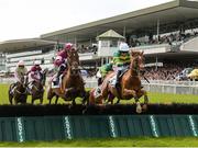 1 August 2017; Eventual winner Housesofparliament, right, with Barry Geraghty up, jump the fifth alongside Cinema De Quartier, with Bryan Cooper up, on their way to winning the Colm Quinn BMW Novice Hurdle during the Galway Races Summer Festival 2017 at Ballybrit, in Galway. Photo by Cody Glenn/Sportsfile