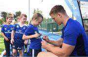 2 August 2017; Josh Van der Flier signs the shirt of Zoe Brennan, aged 6, during a Bank of Ireland Leinster Rugby Summer Camp at Donnybrook Stadium in Donnybrook, Dublin. Photo by David Fitzgerald/Sportsfile