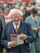 2 August 2017; The President of Ireland Michael D Higgins studies his racecard in the parade ring during the Galway Races Summer Festival 2017 at Ballybrit, in Galway. Photo by Cody Glenn/Sportsfile