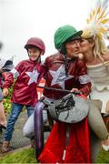 2 August 2017; Davy Russell celebrates with wife Edel and supporter Alan Jordan, age 8, from Navan, Co Meath, after winning the The Tote.com Galway Plate on Balko Des Flos during the Galway Races Summer Festival 2017 at Ballybrit, in Galway. Photo by Cody Glenn/Sportsfile