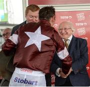 2 August 2017; The President of Ireland Michael D Higgins congratulates Davy Russell after winning the The Tote.com Galway Plate on Balko Des Flos during the Galway Races Summer Festival 2017 at Ballybrit, in Galway. Photo by Cody Glenn/Sportsfile