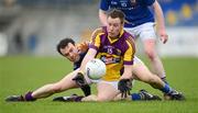 8 April 2012; Paddy Byrne, Wexford, in action against Paul Barden, Longford. Allianz Football League Division 3, Round 7, Longford v Wexford, Glennon Brothers Pearse Park, Co. Longford. Picture credit: Ray McManus / SPORTSFILE