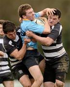 9 April 2012; Jamie Glynn, UCD, is tackled by James Kearns, left, and Jordan Coughlan, Old Belvedere. Fraser McMullen All-Ireland Under 21 Cup Final, UCD v Old Belvedere, Lakelands Park, Terenure, Dublin. Photo by Sportsfile