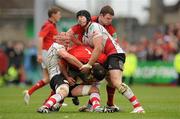 8 April 2012; Wian du Preez, supported by Donnacha Ryan, Munster, is tackled by Dan Tuohy, left, and Stephen Ferris, Ulster. Heineken Cup Quarter-Final, Munster v Ulster, Thomond Park, Limerick. Picture credit: Diarmuid Greene / SPORTSFILE