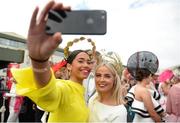 3 August 2017; Cleo Parkinson, originally from London, now living in Moy, Co Tyrone, takes a selfie together with her milner Lori Muldoon, from Eglish, Co Tyrone, during the Galway Races Summer Festival 2017 at Ballybrit, in Galway. Photo by Cody Glenn/Sportsfile