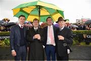 3 August 2017; From left, trainer Joseph O'Brien, owner JP McManus, Kieran McManus, and Frank Berry, manager for JP McManus, watch the replay under the shelter of an umbrella with the colours of JP McManus after sending out Tigris River and Barry Geraghty to win the Guinness Galway Hurdle Handicap during the Galway Races Summer Festival 2017 at Ballybrit, in Galway. Photo by Cody Glenn/Sportsfile