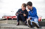 4 August 2017; Friends and avid racegoers Dylan O'Connor, age 8, from Cork, and Daire Enright, age 12, from Limerick, study the form together during the Galway Races Summer Festival 2017 at Ballybrit, in Galway. Photo by Cody Glenn/Sportsfile