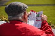 4 August 2017; A racegoer studies the form during the Galway Races Summer Festival 2017 at Ballybrit, in Galway. Photo by Cody Glenn/Sportsfile