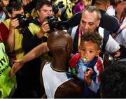 4 August 2017; Mo Farah of Great Britain with his son Hussein celebrates winning the final of the Men's 10,000m event during day one of the 16th IAAF World Athletics Championships at the London Stadium in London, England. Photo by Stephen McCarthy/Sportsfile