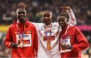 4 August 2017; Silver medallist Joshua Kiprui Cheptegei of Uganda, left, gold medallist Mo Farah of Great Britain and bronze medallist Paul Kipngetich Tanui of Kenya, right, pose on the podium during the medal ceremony following the final of the Men's 10,000m event during day one of the 16th IAAF World Athletics Championships at the London Stadium in London, England. Photo by Stephen McCarthy/Sportsfile