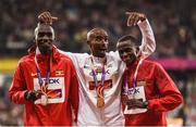 4 August 2017; Silver medallist Joshua Kiprui Cheptegei of Uganda, left, gold medallist Mo Farah of Great Britain and bronze medallist Paul Kipngetich Tanui of Kenya, right, pose on the podium during the medal ceremony following the final of the Men's 10,000m event during day one of the 16th IAAF World Athletics Championships at the London Stadium in London, England. Photo by Stephen McCarthy/Sportsfile