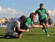 14 April 2012; Gavin Duffy, Connacht, with support from team-mate Henry Fa'afili, goes over to score his side's second try despite the tackle of Robbie Diack, Ulster. Celtic League, Connacht v Ulster, Sportsground, Galway. Picture credit: Barry Cregg / SPORTSFILE