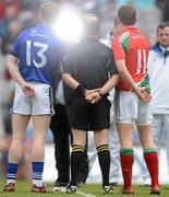 15 April 2012; Team captains Colm Cooper, left, Kerry, and Andy Moran, Mayo, have their photograph taken with referee Eddie Kinsella before the game. Allianz Football League Division 1 Semi-Final, Kerry v Mayo, Croke Park, Dublin. Picture credit: Brendan Moran / SPORTSFILE