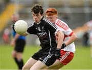 5 August 2017; Roland Anderson of Sligo in action against Fergal Mortimer of Derry  during the Electric Ireland All-Ireland GAA Football Minor Championship Quarter-Final match between Derry and Sligo at Mac Cumhaill Park in Ballybofey, Donegal. Photo by Oliver McVeigh/Sportsfile