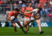 5 August 2017; Joe McElroy of Armagh is tackled by Conall McCann of Tyrone during the GAA Football All-Ireland Senior Championship Quarter-Final match between Tyrone and Armagh at Croke Park in Dublin. Photo by Ramsey Cardy/Sportsfile