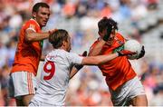 5 August 2017; James Morgan of Armagh is tackled by Conall McCann of Tyrone during the GAA Football All-Ireland Senior Championship Quarter-Final match between Tyrone and Armagh at Croke Park in Dublin. Photo by Ramsey Cardy/Sportsfile