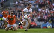 5 August 2017; David Mulgrew of Tyrone races past Brendan Donaghy of Armagh on his way to score the third goal during the GAA Football All-Ireland Senior Championship Quarter-Final match between Tyrone and Armagh at Croke Park in Dublin. Photo by Ray McManus/Sportsfile