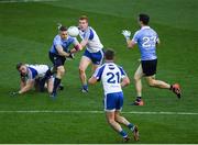 5 August 2017; Eoghan O'Gara of Dublin, under pressure from Colin Walshe, left, Kieran Duffy and Dessie Mone, 21, of Monaghan passes to team mate Michael Darragh Macauley during the GAA Football All-Ireland Senior Championship Quarter-Final match between Dublin and Monaghan at Croke Park in Dublin. Photo by Ray McManus/Sportsfile