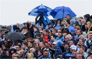 5 August 2017; Supporters on Hill 16 use an umberella to shade a small child from the prevailing rain, as others to the left try and fix theirs, during the GAA Football All-Ireland Senior Championship Quarter-Final match between Dublin and Monaghan at Croke Park in Dublin. Photo by Ray McManus/Sportsfile