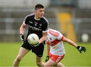 5 August 2017; Evan Lavin of Sligo in action against Fergal Mortimer of Derry  during the Electric Ireland All-Ireland GAA Football Minor Championship Quarter-Final match between Derry and Sligo at Mac Cumhaill Park in Ballybofey, Donegal. Photo by Oliver McVeigh/Sportsfile