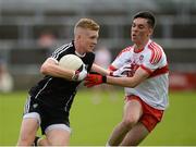 5 August 2017; Red Og Murphy of Sligo in action against Conor McCluskey of Derry  during the Electric Ireland All-Ireland GAA Football Minor Championship Quarter-Final match between Derry and Sligo at Mac Cumhaill Park in Ballybofey, Donegal. Photo by Oliver McVeigh/Sportsfile