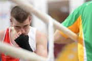 16 April 2012; A dejected Ross Hickey, Ireland, after losing to Dmitri Galagot, Moldova, in their Light Welterweight 64kg bout. AIBA European Olympic Boxing Qualifying Championships, Hayri Gür Arena, Trabzon, Turkey. Picture credit: David Maher / SPORTSFILE