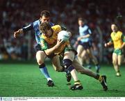 20 September 1992; Tony Boyle, Donegal, is tackled by Mick Deegan, Dublin. All Ireland Football Championship Final, Dublin v Donegal, Croke Park, Dublin. Picture credit; David Maher / SPORTSFILE