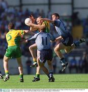 5 August 2002; Donegal's Paul McGonigle and Raymond Sweeney (5) in action against Dublin's Darren Magee and Shane Ryan (11). Dublin v Donegal, All Ireland Football Quarter - Final, Croke Park, Dublin. Picture credit; Damien Eagers / SPORTSFILE