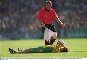 5 August 2002; Linesman, Seamus Prior assists Donegal's Damien Diver, Dublin v Donegal, All Ireland Football Quarter - Final, Croke Park, Dublin. Picture credit; Ray McManus / SPORTSFILE