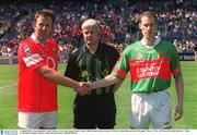 5 August 2002; Team captains Colin Corkery, Cork, and James Nallen, Mayo, shake hands in the presence of Referee John Bannon before the game. Mayo v Cork, All Ireland Football Quarter - Final, Croke Park, Dublin. Picture credit; Brian Lawless / SPORTSFILE