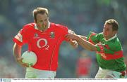5 August 2002; Colin Corkery, Cork, in action against Mayo's Gary Ruane. Mayo v Cork, All Ireland Football Quarter - Final, Croke Park, Dublin. Picture credit; Ray McManus / SPORTSFILE