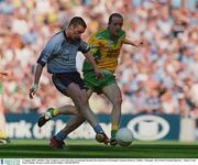 5 August 2002; Dublin's Ray Cosgrove scores his sides second goal despite the attentions of Donegal's Eamon Doherty. Dublin v Donegal, All Ireland Football Quarter - Final, Croke Park, Dublin. Picture credit; David Maher / SPORTSFILE