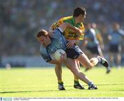 5 August 2002; Peader Andrews, Dublin, is tackled by Brendan Devenney, Donegal. Dublin v Donegal, All Ireland Football Quarter - Final, Croke Park, Dublin. Picture credit; Ray McManus  / SPORTSFILE