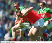 5 August 2002; Colin Corkery, Cork, in action against Mayo's David Heaney. Mayo v Cork, All Ireland Football Quarter - Final, Croke Park, Dublin. Picture credit; Damien Eagers / SPORTSFILE