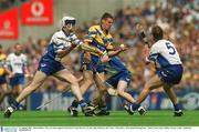 11 August 2002; John Reddan, Clare, in action against Waterford's Tony Browne (5) and Andy Moloney, left. Clare v Waterford, All Ireland Hurling Semi - Final, Croke Park, Dublin. Picture credit; Aoife Rice / SPORTSFILE