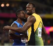 5 August 2017; Justin Gatlin of the USA, left, is congratulated by third place Usain Bolt of Jamaica after winning the final of the Men's 100m event during day two of the 16th IAAF World Athletics Championships at the London Stadium in London, England. Photo by Stephen McCarthy/Sportsfile