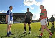 24 October 2010; Skyrne captain Aidan Tuite, left, and Steven Byrne, Rathnew, look on as referee Gary McCormack tosses a coin before the game. AIB GAA Football Leinster Club Senior Championship Quarter-Final, Skyrne v Rathnew, Pairc Tailteann, Navan, Co. Meath. Picture credit: Barry Cregg / SPORTSFILE