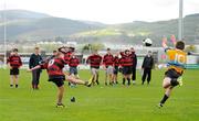 18 April 2012; The Rathcoole Community College out half Hugh Walsh runs out to try and block down a last kick of the game penalty kick by his St. Colmcilles opposite number Mark Kirwan. The kick failed and the game ended in a draw. South Dublin County Council Junior Cup Final, Rathcoole Community College v St. Colmcilles, Tallaght Stadium, Tallaght, Dublin. Picture credit: Ray McManus / SPORTSFILE