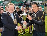 18 April 2012; The Rathcoole Community College captain Michael Russel is presented with the cup by Cllr. Mick Duff, Deputy Mayor, South Dublin County Council, after the game. South Dublin County Council Senior Cup Final, Rathcoole Community College v St. Colmcilles, Tallaght Stadium, Tallaght, Dublin. Picture credit: Ray McManus / SPORTSFILE