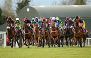 9 April 2012; The eventual winner Lion Na Bearnai, with Andrew Thornton up, third from left, and the field make their way to the first fence in the Ladbrokes Irish Grand National Steeplechase. Fairyhouse Racecourse, Co. Meath. Picture credit: Ray McManus / SPORTSFILE