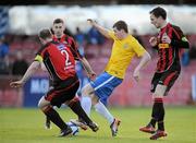 20 April 2012; Jordan Keegan, Monaghan United, in action against Owen Heary, left, and Derek Pender, Bohemians. Airtricity League Premier Division, Bohemians v Monaghan United, Dalymount Park, Dublin. Picture credit: Brian Lawless / SPORTSFILE
