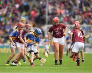 6 August 2017; Amy O Donnell St. Michael's National School, Clonmel, Co Tipperary,  in action against Aoife Ní Drisceoil of Scoil Lorcáin, Baile na Manach, Co Dublin, representing Galway, during INTO Cumann na mBunscol GAA Respect Exhibition Go Games at Galway v Tipperary - GAA Hurling All-Ireland Senior Championship Semi-Final at Croke Park in Dublin Photo by Ray McManus/Sportsfile