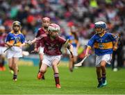 6 August 2017; Sophia Bentley of Bayside Senior N.S., Co Galway, representing Galway, in action against Clara McDonnell of Mercy Convent National School, Naas, Co Kildare, representing Tipperary, during INTO Cumann na mBunscol GAA Respect Exhibition Go Games at Galway v Tipperary - GAA Hurling All-Ireland Senior Championship Semi-Final at Croke Park in Dublin Photo by Ray McManus/Sportsfile