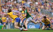7 August 2017; Keith Higgins of Mayo skips the tackle David Murray of Roscommon on his way to scoring his side's third goal during the GAA Football All-Ireland Senior Championship Quarter Final replay match between Mayo and Roscommon at Croke Park in Dublin. Photo by Ramsey Cardy/Sportsfile