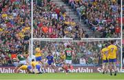 7 August 2017; Roscommon goalkeeper Colm Lavin watches as Keith Higgins of Mayo edges his way to score the third goal in the 28th minute  during the GAA Football All-Ireland Senior Championship Quarter-Final Replay match between Mayo v Roscommon at Croke Park, in Dublin. Photo by Ray McManus/Sportsfile