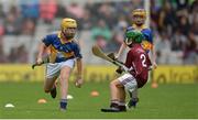 6 August 2017; Harry Codd of Rathnure NS, Enniscorthy, Co Wexford, representing Tipperary, in action against Faolán Ó Ceallaigh of Gaelscoil Eoghain Uí Thuairisc, Co Carlow, representing Galway, during the INTO Cumann na mBunscol GAA Respect Exhibition Go Games at Galway v Tipperary - GAA Hurling All-Ireland Senior Championship Semi-Final at Croke Park in Dublin. Photo by Piaras Ó Mídheach/Sportsfile